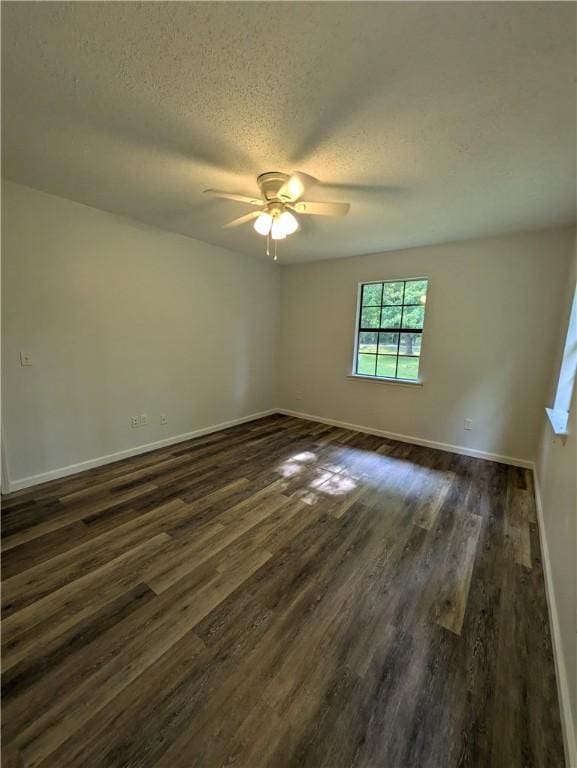 116 Stegall Rd, Clarksville, AR 72830 - empty room with dark wood-style floors, a textured ceiling, and a ceiling fan