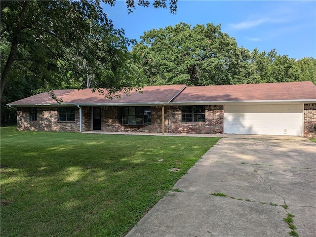 116 Stegall Rd, Clarksville, AR 72830 - single story home featuring concrete driveway, a front yard, brick siding, and a garage