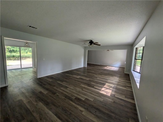 116 Stegall Rd, Clarksville, AR 72830 - unfurnished room with a textured ceiling, dark wood-style floors, and ceiling fan