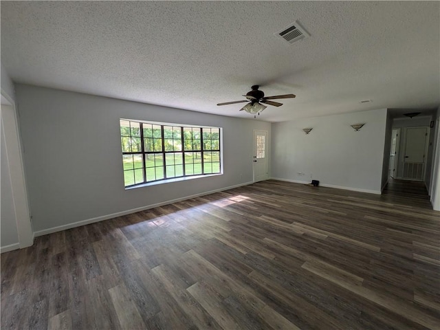 116 Stegall Rd, Clarksville, AR 72830 - unfurnished room featuring a textured ceiling, ceiling fan, and dark wood-style floors