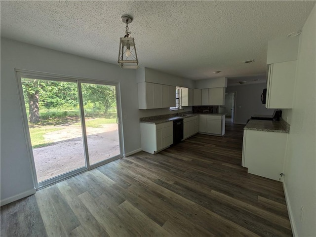 116 Stegall Rd, Clarksville, AR 72830 - kitchen with a textured ceiling, dark wood-style flooring, white cabinetry, range, and dishwasher