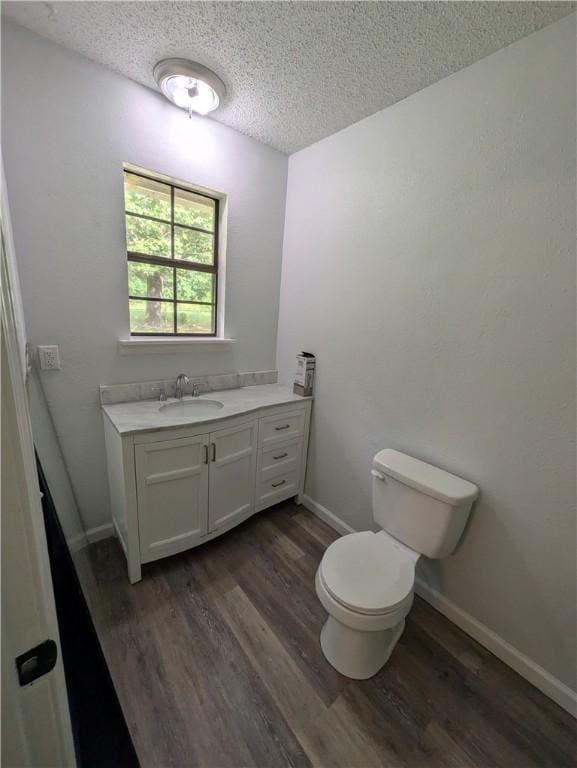 116 Stegall Rd, Clarksville, AR 72830 - bathroom with a textured ceiling, vanity, and wood finished floors