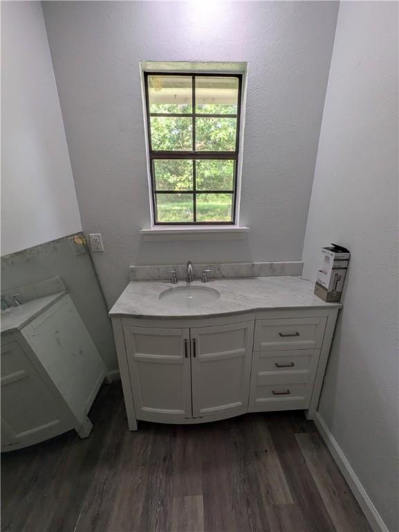 116 Stegall Rd, Clarksville, AR 72830 - bathroom featuring wood finished floors and vanity