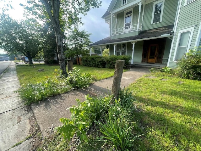 803 W Main St, Clarksville, AR 72830 - view of grassy yard featuring covered porch