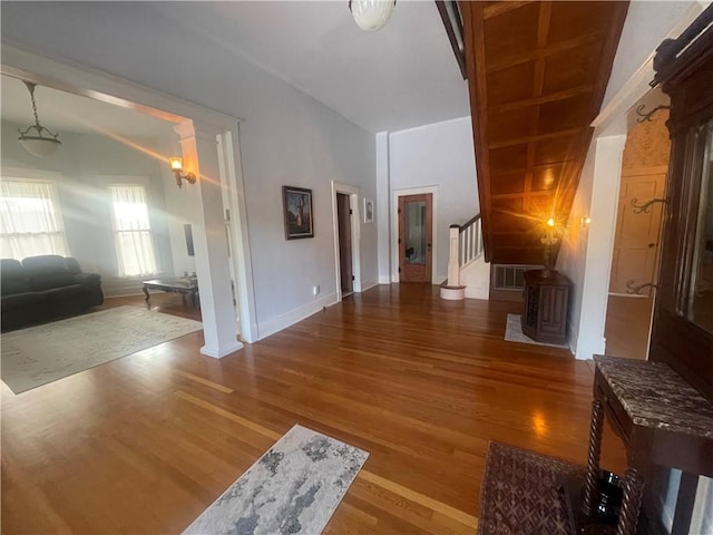 803 W Main St, Clarksville, AR 72830 - living room with stairs, wood finished floors, and baseboards