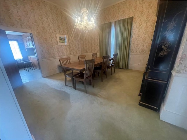 803 W Main St, Clarksville, AR 72830 - dining area featuring wallpapered walls, a chandelier, a decorative wall, a wainscoted wall, and carpet flooring