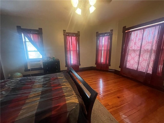 803 W Main St, Clarksville, AR 72830 - bedroom with hardwood / wood-style flooring and baseboards