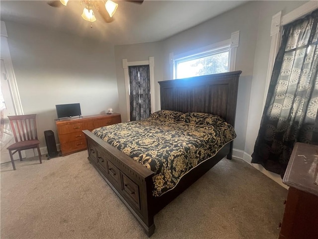803 W Main St, Clarksville, AR 72830 - bedroom featuring light carpet, baseboards, and ceiling fan