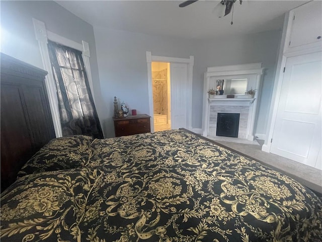 803 W Main St, Clarksville, AR 72830 - bedroom with a fireplace, carpet flooring, connected bathroom, and ceiling fan