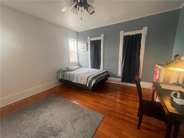 803 W Main St, Clarksville, AR 72830 - bedroom with wood finished floors, baseboards, and ceiling fan