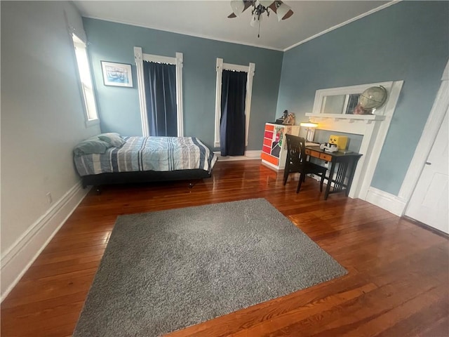 803 W Main St, Clarksville, AR 72830 - bedroom with wood finished floors, ornamental molding, baseboards, and a ceiling fan