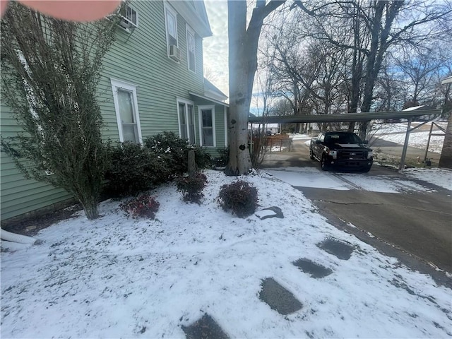 803 W Main St, Clarksville, AR 72830 - snowy yard with a carport