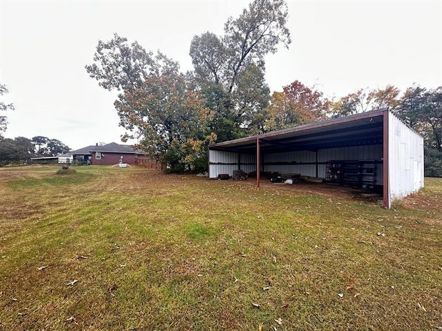5121 E State Highway 22, Paris, AR 72855 - view of green lawn featuring an outbuilding, a detached carport, and an outdoor structure