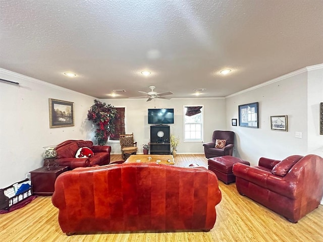 5121 E State Highway 22, Paris, AR 72855 - living area with wood finished floors, crown molding, a ceiling fan, and recessed lighting