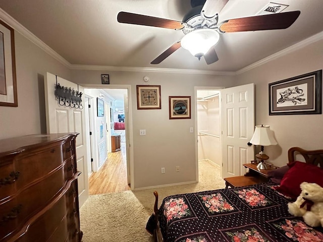 5121 E State Highway 22, Paris, AR 72855 - bedroom with light carpet, a walk in closet, crown molding, and ceiling fan