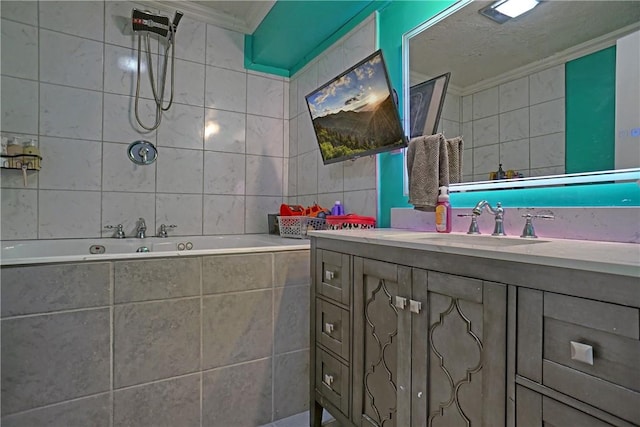 full bathroom featuring vanity, tiled shower / bath combo, ornamental molding, and tile walls