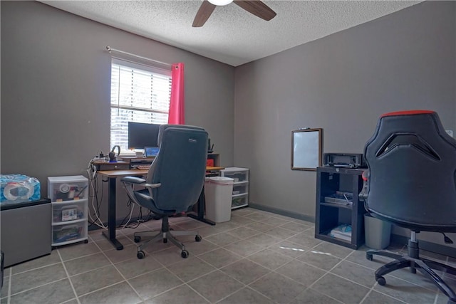 tiled home office with a textured ceiling and a ceiling fan