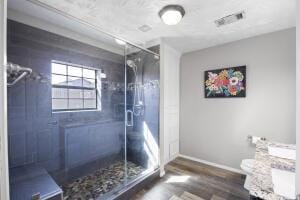 15515 Ar-105, Hector, AR 72843 - bathroom featuring visible vents, baseboards, a shower stall, and wood finished floors