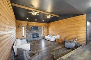15515 Ar-105, Hector, AR 72843 - living area featuring wood finished floors, ceiling fan, a fireplace, and vaulted ceiling