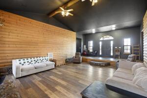15515 Ar-105, Hector, AR 72843 - living room with lofted ceiling with beams, a ceiling fan, and wood finished floors