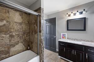 15515 Ar-105, Hector, AR 72843 - full bathroom featuring combined bath / shower with glass door and vanity