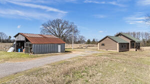 15515 Ar-105, Hector, AR 72843 - view of yard featuring an outbuilding and a detached garage