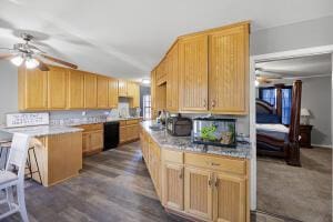 15515 Ar-105, Hector, AR 72843 - kitchen with dark wood finished floors, a kitchen bar, a peninsula, a ceiling fan, and dishwasher