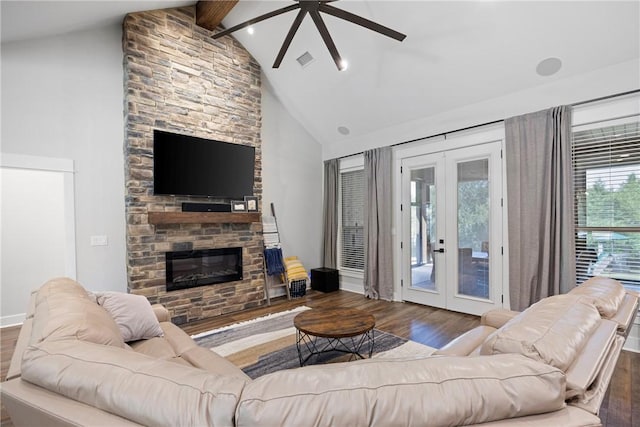 251 Kordsmeier Ln, Morrilton, AR 72110 - living room with french doors, wood finished floors, ceiling fan, beamed ceiling, and a stone fireplace