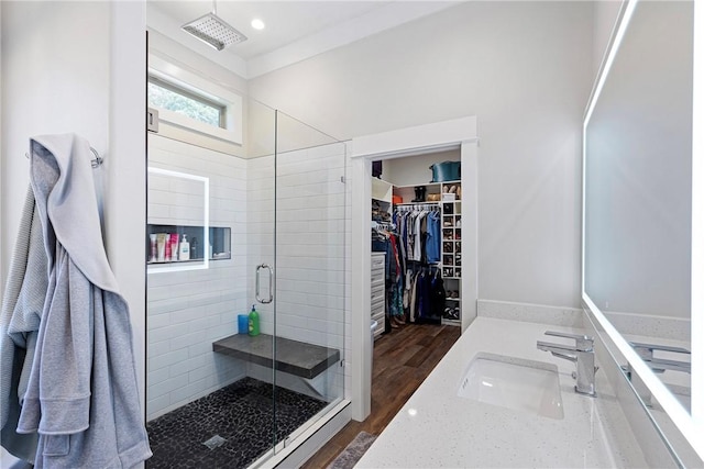 251 Kordsmeier Ln, Morrilton, AR 72110 - full bath featuring a stall shower, vanity, a walk in closet, wood finished floors, and recessed lighting