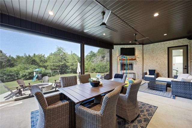 251 Kordsmeier Ln, Morrilton, AR 72110 - view of patio / terrace with a playground, outdoor dining area, ceiling fan, and an outdoor living space with a fire pit
