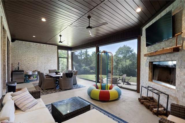 251 Kordsmeier Ln, Morrilton, AR 72110 - view of patio / terrace featuring outdoor dining space, an outdoor living space with a fireplace, and a ceiling fan