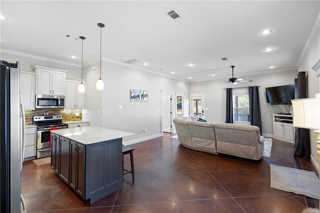 251 Kordsmeier Ln, Morrilton, AR 72110 - kitchen with stainless steel appliances, open floor plan, backsplash, recessed lighting, and light countertops
