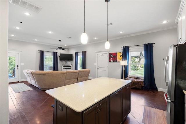 251 Kordsmeier Ln, Morrilton, AR 72110 - kitchen with freestanding refrigerator, open floor plan, plenty of natural light, crown molding, and recessed lighting