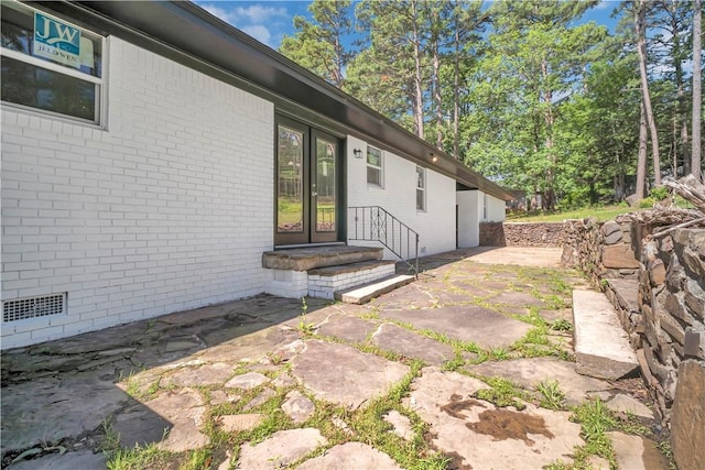 922 Scenic Dr, Perryville, AR 72126 - view of exterior entry with brick siding and a patio