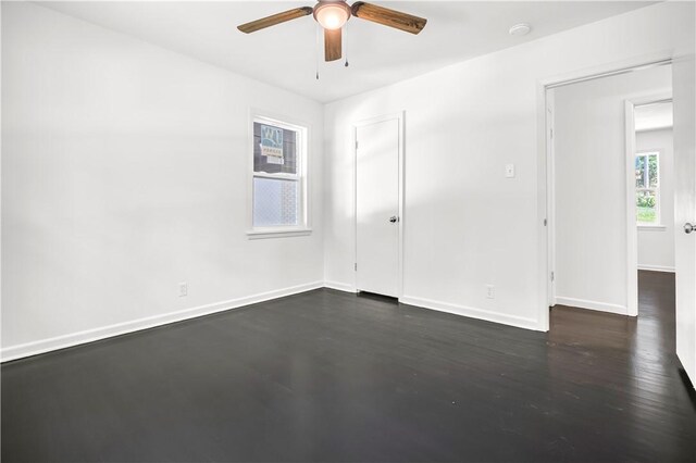 922 Scenic Dr, Perryville, AR 72126 - empty room featuring ceiling fan, baseboards, and dark wood-style flooring