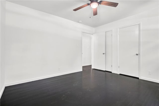 922 Scenic Dr, Perryville, AR 72126 - unfurnished bedroom with wood finished floors, baseboards, and ceiling fan