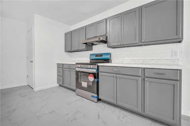 922 Scenic Dr, Perryville, AR 72126 - kitchen with stainless steel electric range, gray cabinets, under cabinet range hood, light marble finish flooring, and baseboards