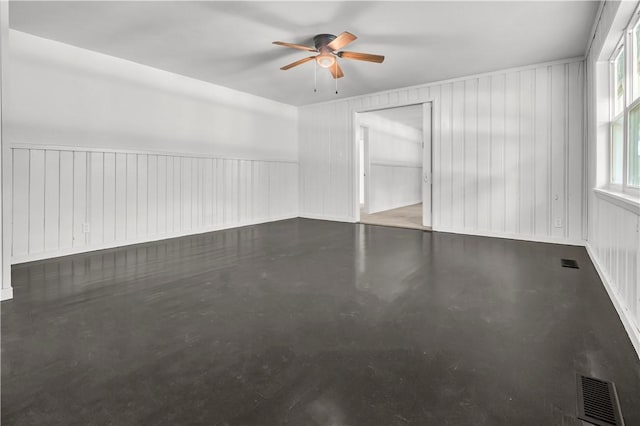 922 Scenic Dr, Perryville, AR 72126 - empty room with ceiling fan and finished concrete flooring