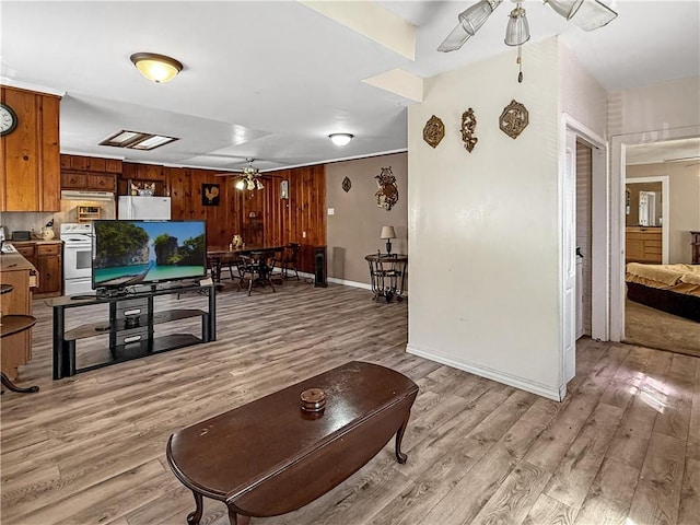206 Arkansas St, Danville, AR 72833 - living room with ceiling fan, light wood-type flooring, and baseboards