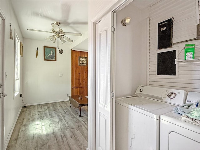 206 Arkansas St, Danville, AR 72833 - laundry room featuring separate washer and dryer, ceiling fan, light wood-style floors, and baseboards