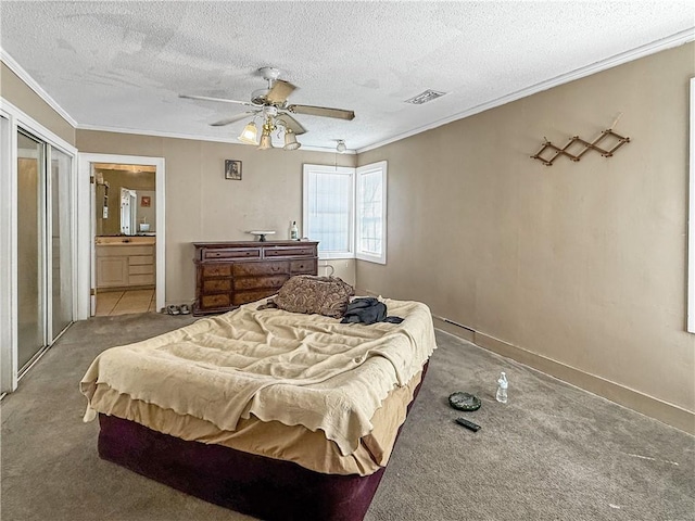 206 Arkansas St, Danville, AR 72833 - carpeted bedroom with crown molding, a textured ceiling, ensuite bathroom, and a ceiling fan