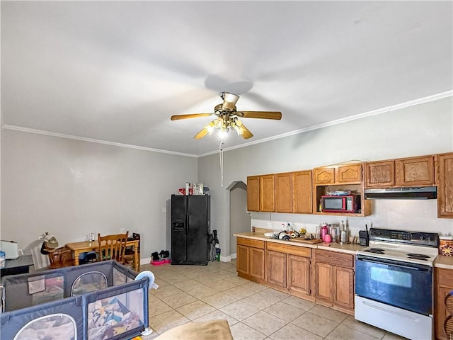 206 Arkansas St, Danville, AR 72833 - kitchen with electric stove, under cabinet range hood, black fridge, a ceiling fan, and light countertops
