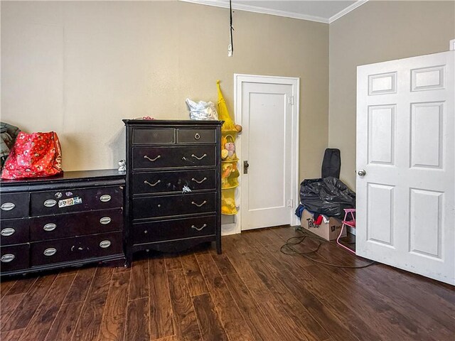 206 Arkansas St, Danville, AR 72833 - bedroom featuring crown molding and dark wood-style flooring