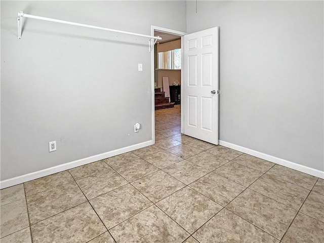 206 Arkansas St, Danville, AR 72833 - spare room with tile patterned flooring and baseboards