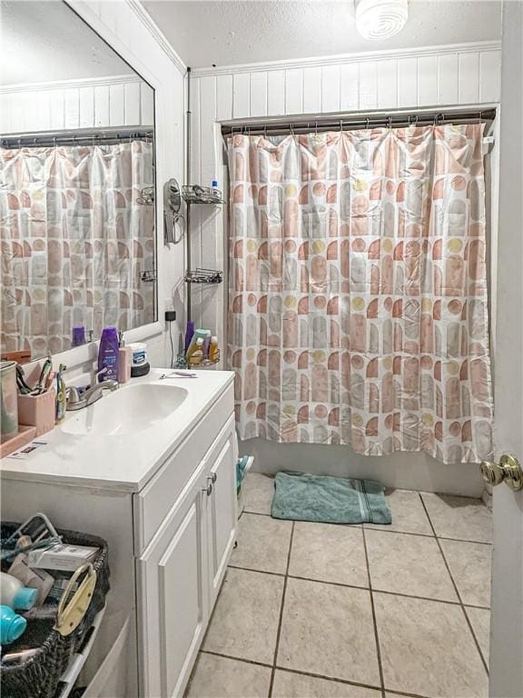 206 Arkansas St, Danville, AR 72833 - full bathroom with tile patterned flooring, shower / tub combo, vanity, and a textured ceiling