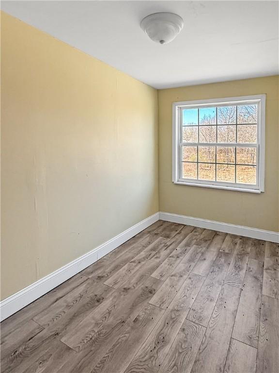 206 Arkansas St, Danville, AR 72833 - spare room with wood finished floors and baseboards