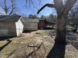 281 Blackwell Rd, Atkins, AR 72823 - view of property exterior featuring a shed, an outbuilding, and a carport
