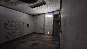 below grade area with a textured ceiling