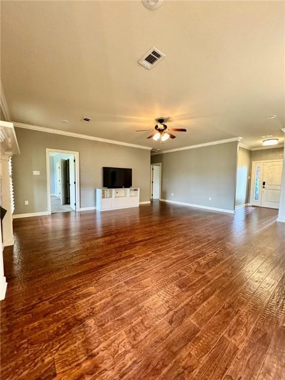 335 Point W, Conway, AR 72034 - unfurnished living room with dark wood-style floors, baseboards, visible vents, a ceiling fan, and crown molding