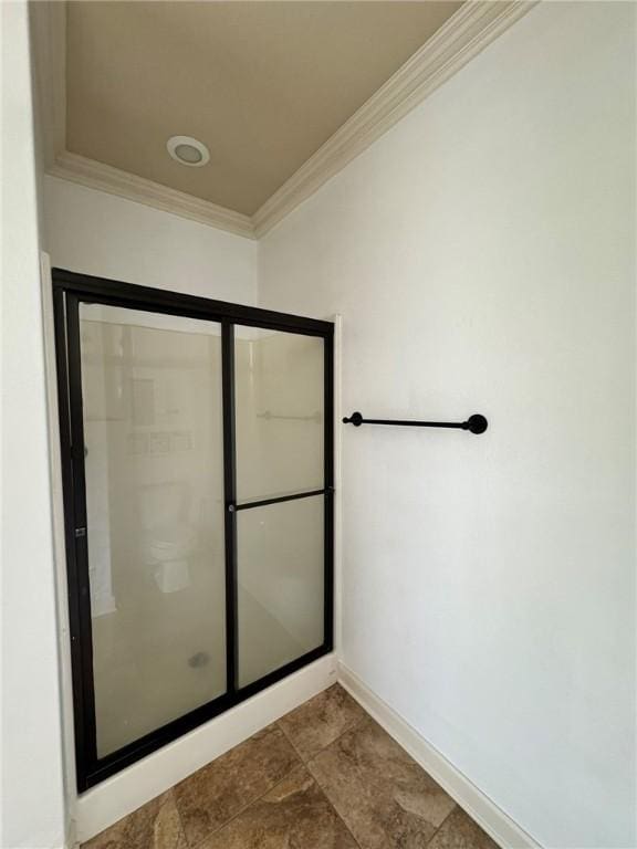 335 Point W, Conway, AR 72034 - bathroom featuring baseboards, a shower with door, and crown molding